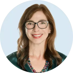 Photo of Cheryl Dillon standing with the Equitable Mediation team in a bright conference room, all smiling and ready to guide clients through an amicable divorce process. For compassionate, expert support from Cheryl Dillon and our team, call Equitable Mediation at (877) 732-6682 today.