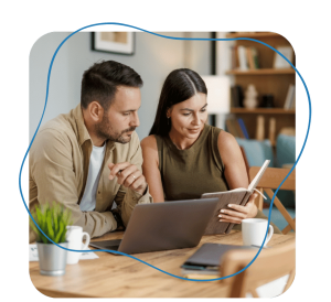 A couple reviewing divorce settlement documents together during an online single-issue mediation session.